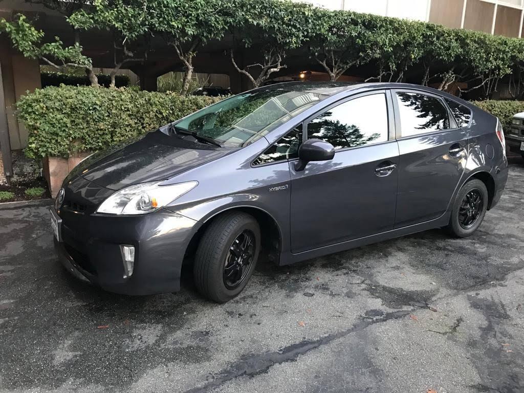 A car parked in a parking lot Description automatically generated